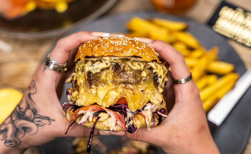  Green Park Brasserie - Person holding burger